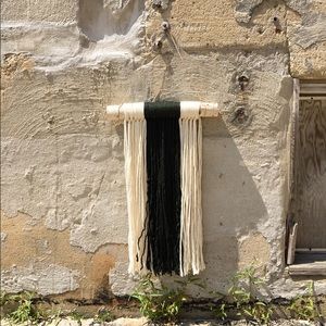 handmade green and white macrame wall hanging